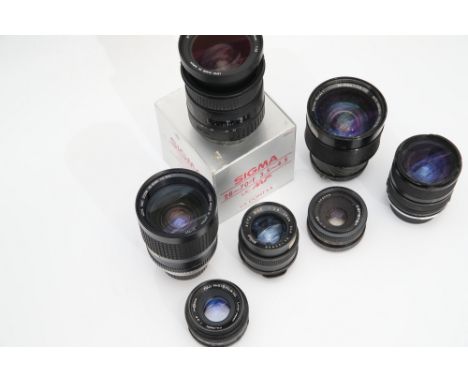 A Small Selection of Various Lenses, including Fujinon f/2.2 55mm, Braun Auto Wide f/2.8 28mm and more, most with haze / ligh