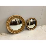 Two Regency style circular giltwood and composition convex wall mirrors, larger diameter 58cm.