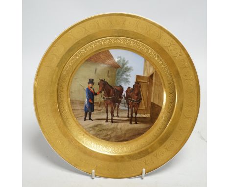 A Berlin porcelain dish painted with a groom with horses, first half of 19th century, 25cm diameter Light scratch to painted 
