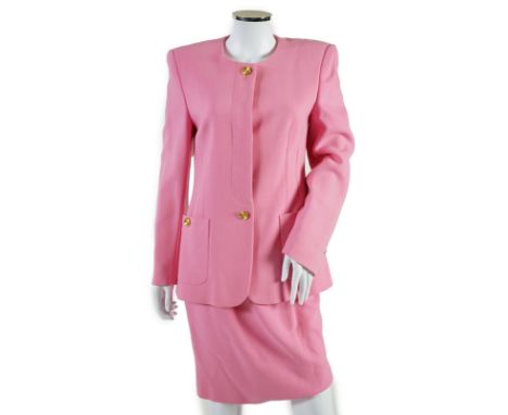 A pink Escada suit with a silk blouse top. Proceeds to Happy Paws Puppy Rescue