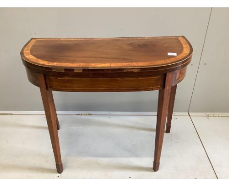 A George III banded mahogany D shape folding card table, width 91cm, depth 43cm, height 74cm.  Condition - fair