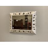 A wooden framed wall mirror, later painted, width 101cm, height 74cm. Condition - poor