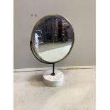A mid century brass framed swivel toilet mirror, on circular marble base, height 48cm. Condition -