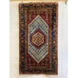 A North West Persian rug, 182 x 101cm. Condition - fair