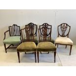 Two Hepplewhite period mahogany dining chairs, a 19th century Sheraton design elbow chair, a pair of