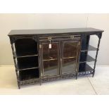 A late Victorian Aesthetic Movement ebonised side cabinet, width 167cm, depth 43cm, height 105cm.
