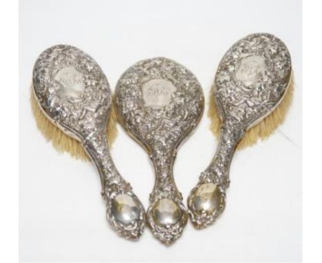 A George V Art Deco silver and enamel mounted ten piece mirror and brush set, Birmingham, 1931, together with an earlier repo