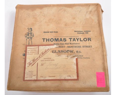 
A boxed set of early 20th century wooden Thomas Taylor Scotch bowling bowls complete with original inner wrappings and with 