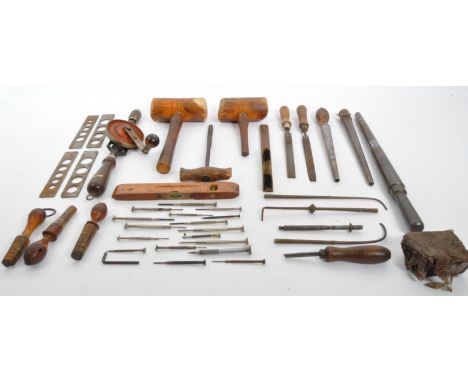 An assortment of early 20th Century and later wooden and cast iron watch &amp; ring making tools. To include; J A&nbsp; Chapm
