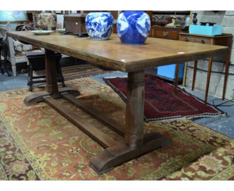 An antique oak refectory table in the manner of Robert 'Mouseman' Thompson by Hamptons, Pall Mall East, London, the rectangul