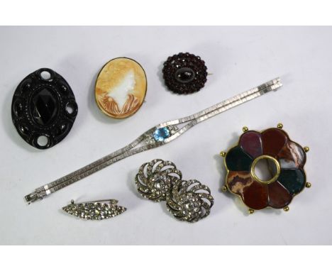 A Celtic brooch set mixed agates in gilt metal, carved jet brooch with metal fitting, garnet cluster brooch, gilt metal setti