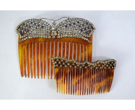A hair comb having pierced stylised butterfly decoration set with white and mauve paste in gilt metal to/w smaller paste set 