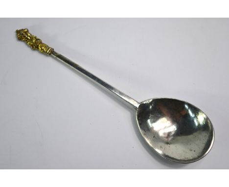 A Charles II period West Country silver Buddha knop spoon with gilt finial on flattened hexagonal stem, the spoon-back with p