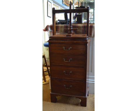 An antique mahogany book press, on four drawer chest, raised on shaped bracket feet