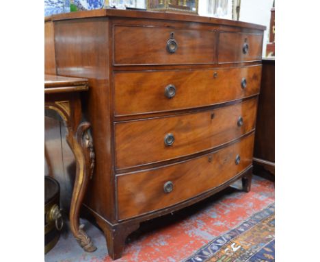 A Victorian mahogany bowfront chest of two short over three long graduated drawers, on shaped bracket feet