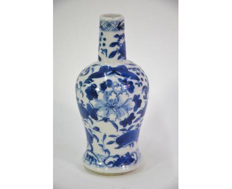 A small Chinese blue and white vase, decorated with birds and flowers, the base with Kangxi four-character mark but not of th