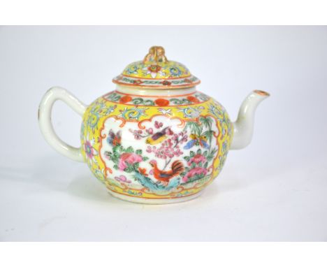 A Chinese yellow-ground, famille rose teapot and domed cover with gilt peach finial; decorated with panels depicting birds an