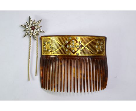 An Art Nouveau hair comb having gilt decoration set white paste to/w paste set star shaped hinged hair pin (2)