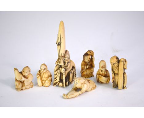 Seven ivory netsuke, including: one of Jurojin holding a makemono; and one of Gama Sennin holding his magic toad; the tallest