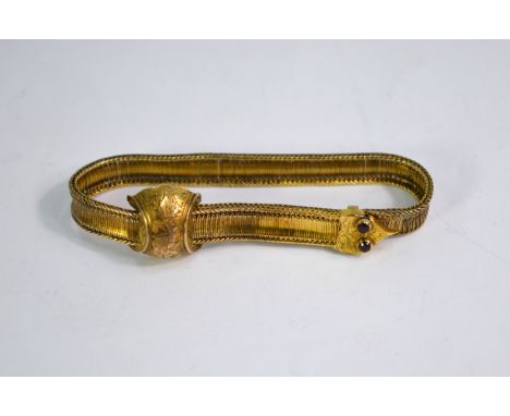 A Victorian yellow gold mesh bangle having serpent head terminal with sliding adjustment, with garnet set eyes, approx 15.5g