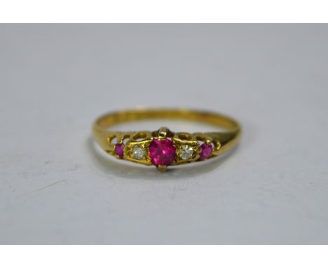 An 18ct yellow gold three stone ruby and diamond ringClaws in need of attention