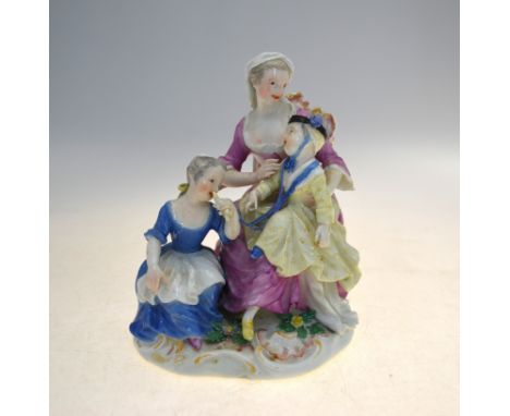 An 18th century Meissen figural group of a seated mother and children, underglaze blue crossed swords to base, 17.5 cm highFi