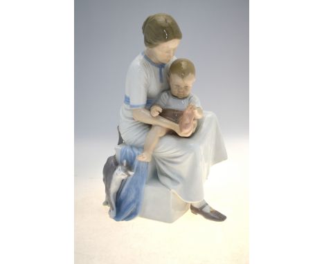 Bing &amp; Grondahl study of a mother seated on steps with a child on her lap, no. 1829, 31 cm highChip to rear at base of st