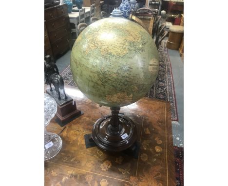 A vintage Phillips 14inch Terrestrial Globe, no 2615, with gilt brass fittings, raised on a circular platform stand, 65 cm hi