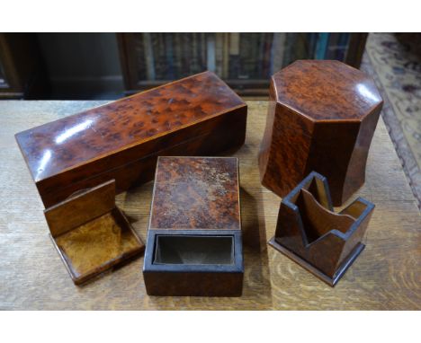 An Art Deco amboyna octagonal tobacco jar and cover, to/w a cigarette box incorporating ashtray, another cigarette box with t