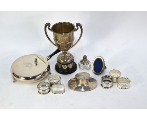 A silver two-handled trophy cup, London 1922, with ebonised plinth, to/w an oval capstan inkwell on weighted foot, six variou