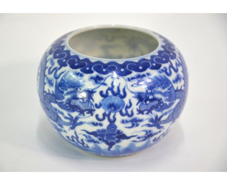 A blue and white, Dragon decorated bowl, 9.5cm high, the base with Kangxi six-character mark but not of the periodNo apparent