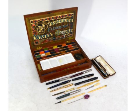A 19th century teak fitted watercolours box, lithograph paper label within inscribed 'Superior Elementary Water Colours', wit