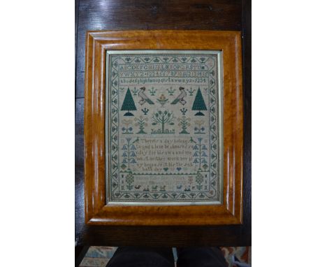 A George IV petit point and cross-stitch sampler worked with alphabets, numbers, flora, fauna and spiritual verse, by Sarah E