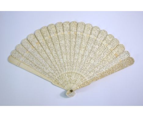 A Cantonese ivory fan with twenty sticks; decorated with typical designs of figures, gardens and trees; 19 cm high, Qing Dyna