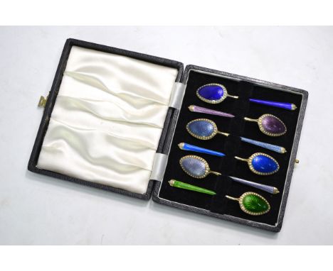 A cased David Anderson harlequin set of six silver gilt and enamel coffee spoonsOne with large chip and attempted restoration
