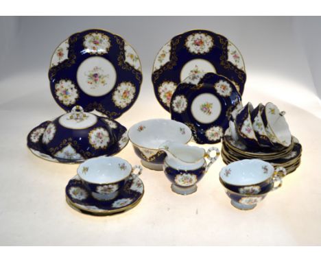 Coalport tea service, blue scale ground decorated with gilt edged floral reserves, pattern x3449/9, retailed by Phillips, Mou