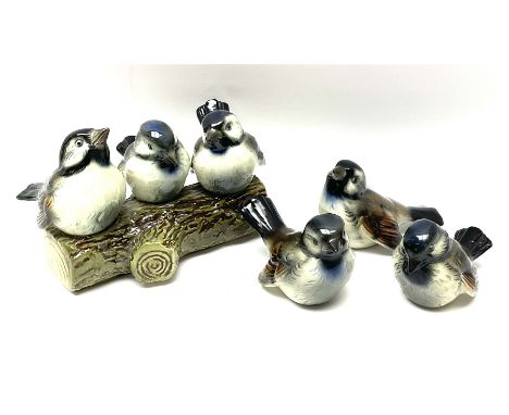 A Goebel figure group modelled as three bluetits seated upon a branch section, together with three further separate Goebel bl