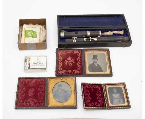 A collection of three Victorian and later ambrotype photographs in leather bound gilt miniature frames, along with a collecti