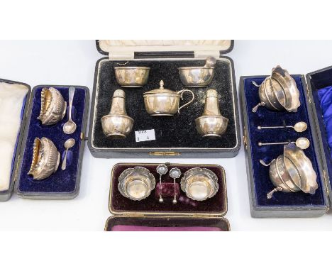 Four various boxed silver cruet sets to include:1. late Victorian pair of oval gadrooned salts, Birmingham, 1896, with two sp