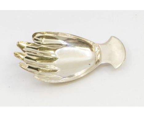 A George III silver caddy spoon in the form of a right hand, plain handle, hallmarked by JS (John Salkeld or Josiah Snatt), L