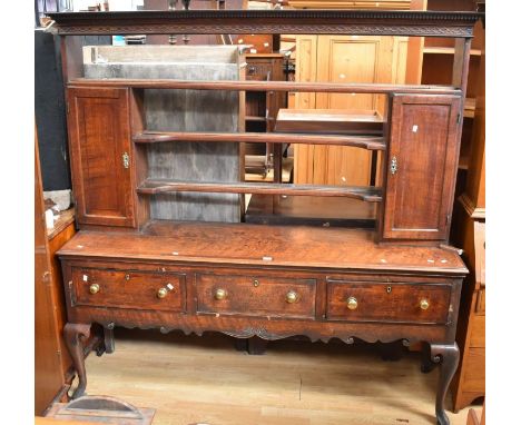 George III oak dresser with three main drawers to base, brass knob handles and cabriole legs, with a three-shelf plate rack a