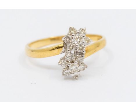 An 18ct gold and diamond 'toi-et-moi' flower head ring, claw set round brilliant cut diamonds, total diamond weight stamped t