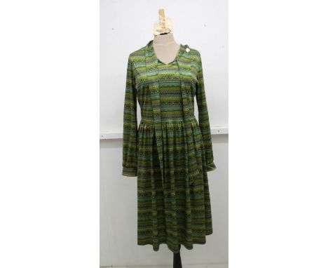 A collection of items to include: A blue brocade shift dress, 1960s; A late 1960s/early 1970s green cotton Empire line dress 