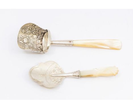 A William IV silver caddy shovel, mother-of-pearl handle, the body chased with flowers and foliage, hallmarked by Gervaise Wh