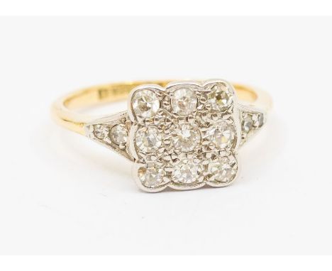 An Edwardian diamond and 18ct gold cluster ring, square top platinum set with three rows of diamonds, setting approx 10 x 10m