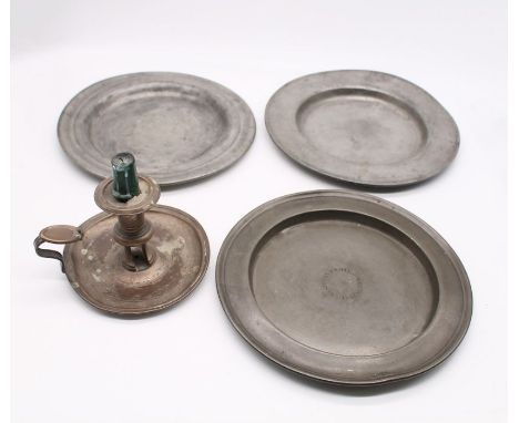 18th and 19th Century pewter plates, one of which is a Wesleyan Arms collection plate along with pewter chamber stick