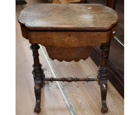 A late Victorian walnut sewing table on castors, along with a 19th Century folding card table in mahogany, on ball and claw f