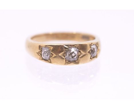 An early 20th century diamond and 18ct gold ring, comprising three old cut diamonds star set, total diamond weight approx 0.3