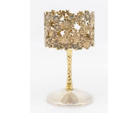 Stuart Devlin: a Modernist silver and silver gilt candle holder, plain silver circular base with textured gilt stem above pla