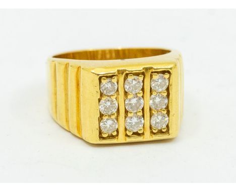 A gents diamond set 18ct gold signet ring, comprising three rows of round brilliant cut diamonds, total diamond weight approx